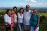 Supplied by Norman Lister Bramwell; L-R Grand daughters Rachel Wollenweber and Imogen Ryan, daughters Michelle Wollenweber and Vanessa Ryan, his nibs with Kaye his better half! The background is the Glasshouse mountains near Malany QLD. Father's Day 2006